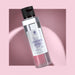 Natuurlijke Tweefasige Make-up Remover RedMoringa met Moringa-extract en korenbloemwater, 100 ml fles op roze achtergrond